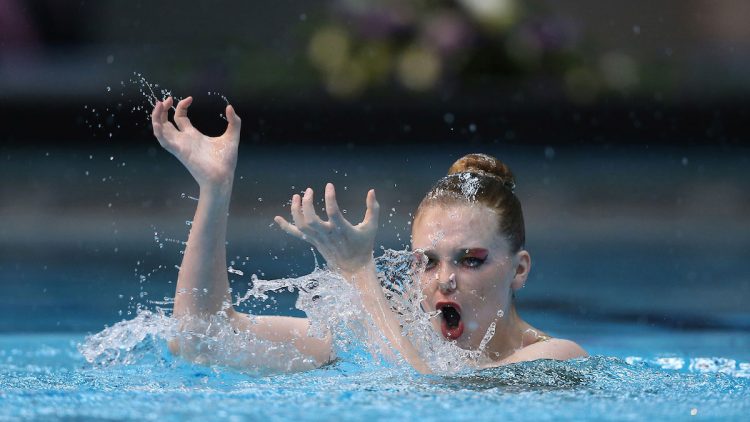 Sync and Giggle: A Whimsical Collection of Synchronized Swimming Photos