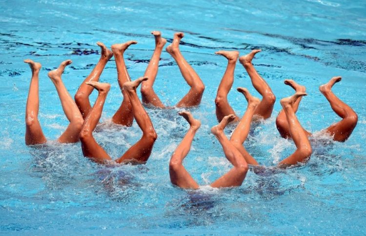 Sync and Giggle: A Whimsical Collection of Synchronized Swimming Photos