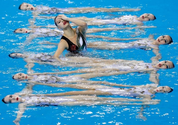 Sync and Giggle: A Whimsical Collection of Synchronized Swimming Photos