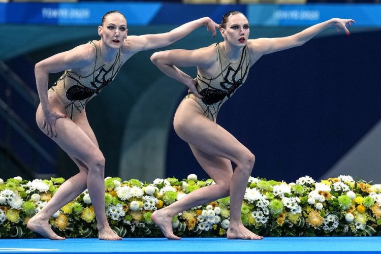 Sync and Giggle: A Whimsical Collection of Synchronized Swimming Photos