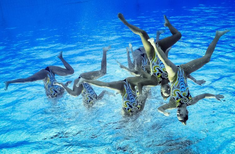 Sync and Giggle: A Whimsical Collection of Synchronized Swimming Photos