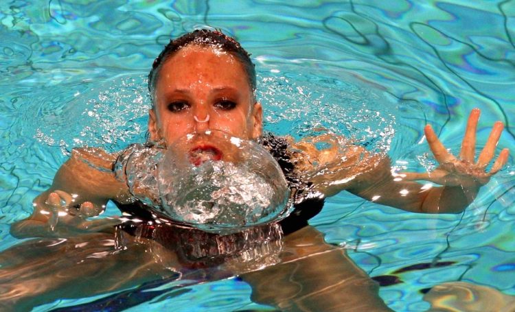 Sync and Giggle: A Whimsical Collection of Synchronized Swimming Photos